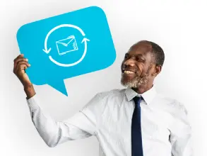Professional composing a business email on a laptop